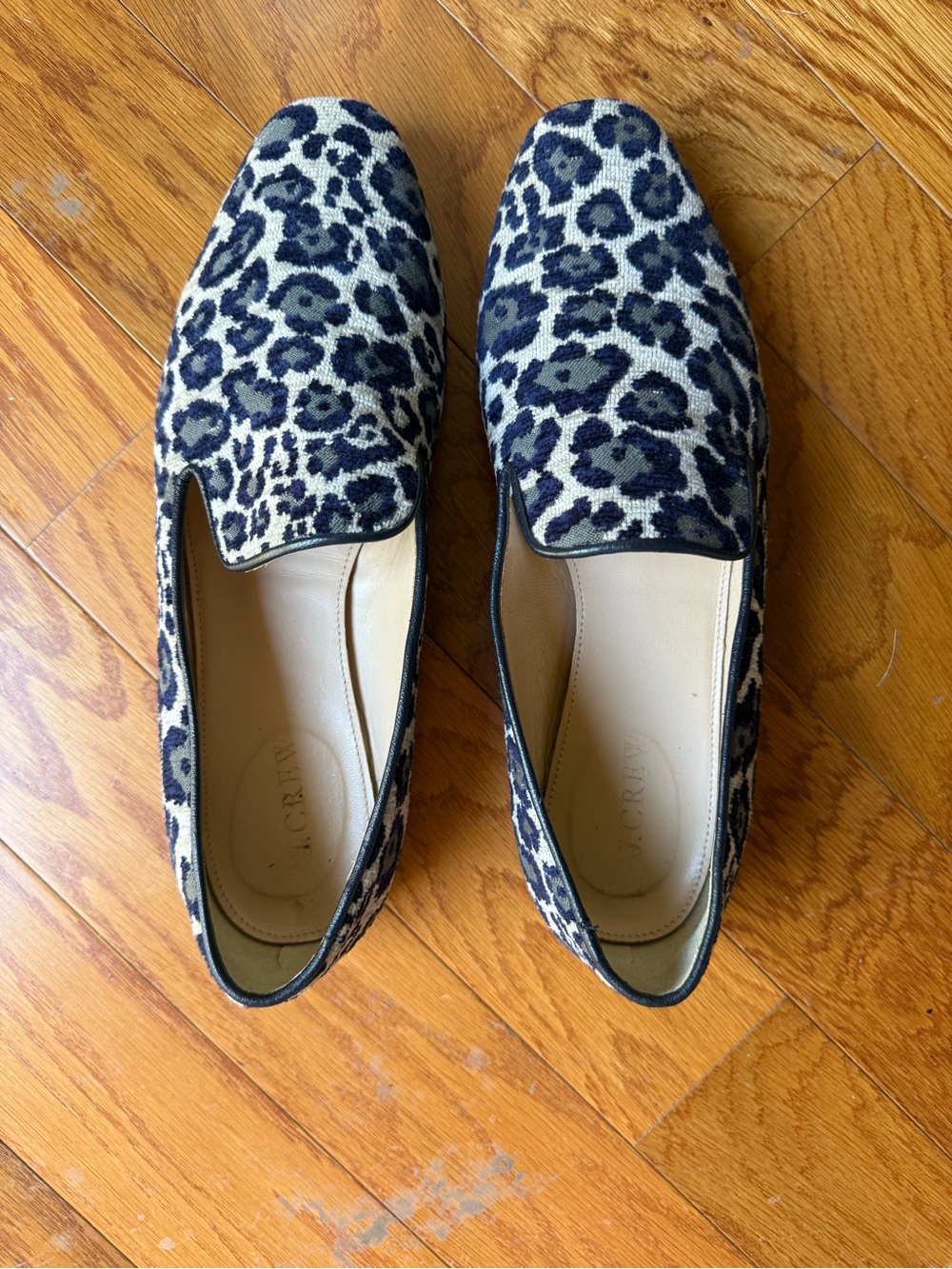 J. Crew Snow Leopard Print Slip-On Loafers in Black, Grey, and Off White.